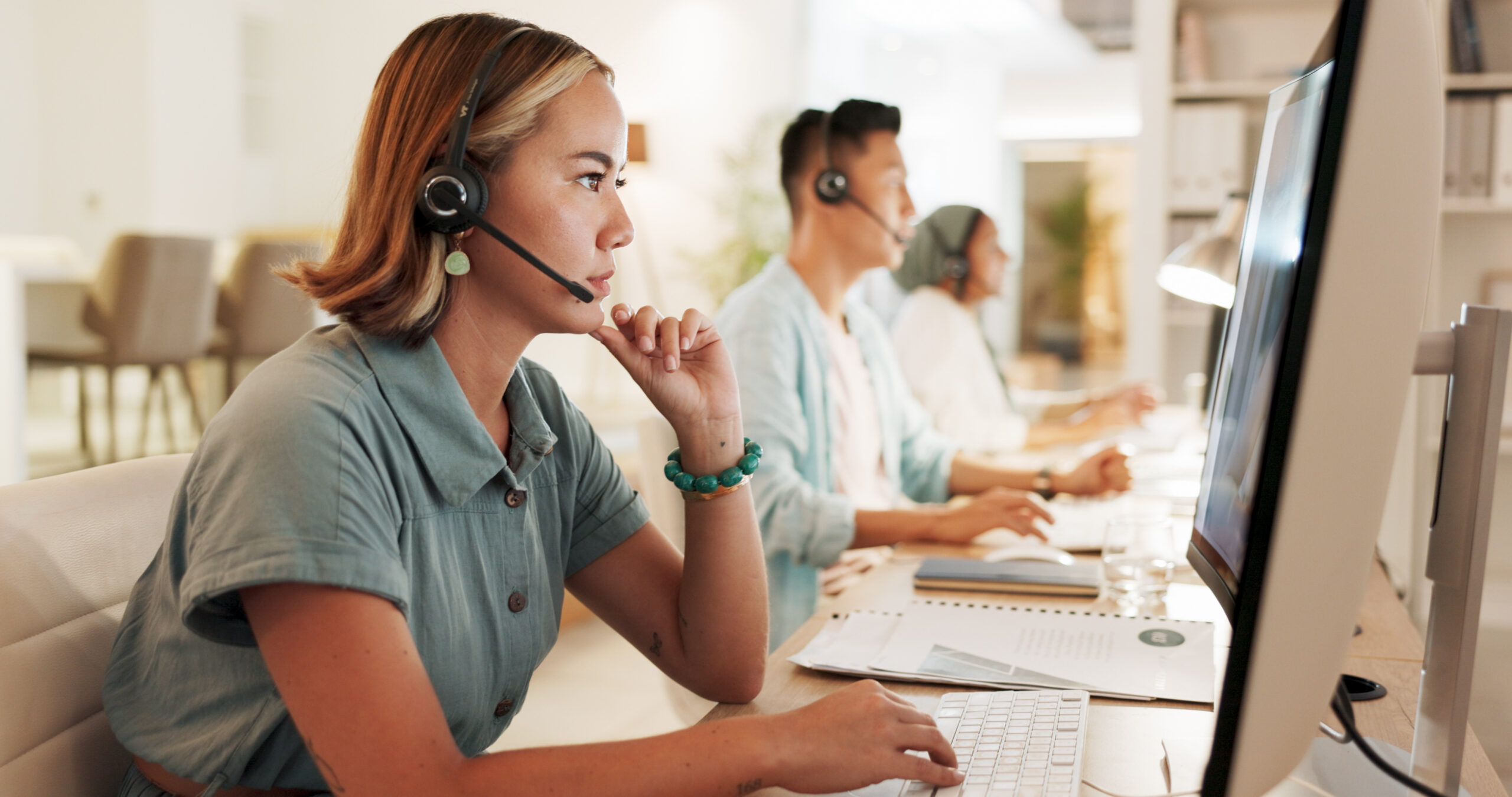 Call center, agent and thinking with woman in office for contact us, communication and customer service. Saleswoman, help desk and technical support with person in consulting agency for telemarketing